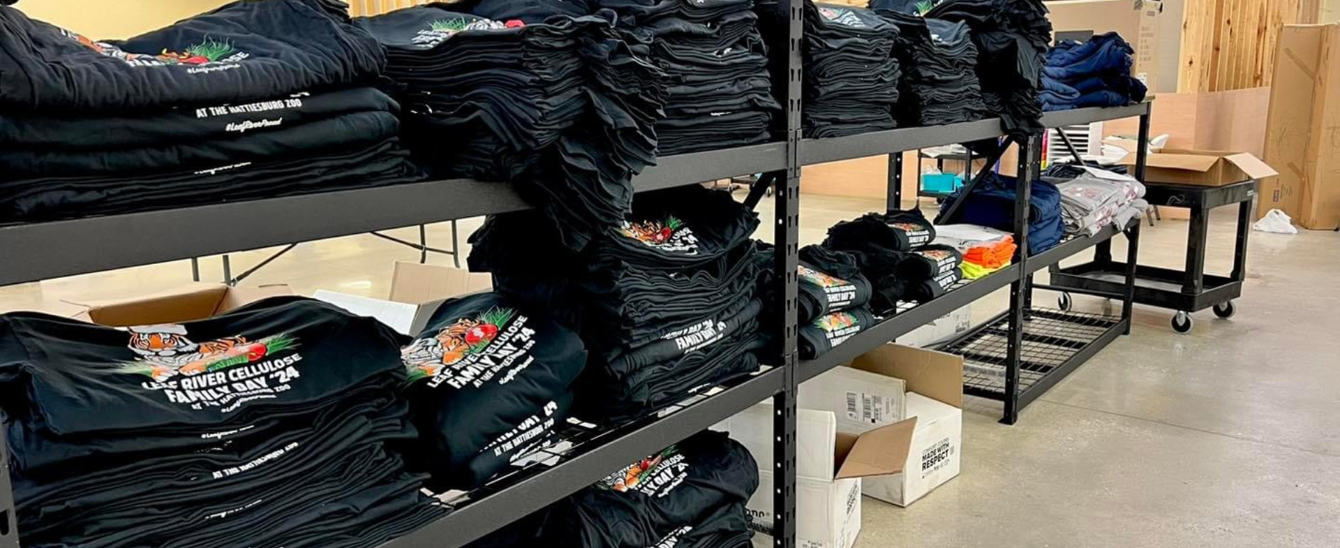 stacks of shirts that say family day