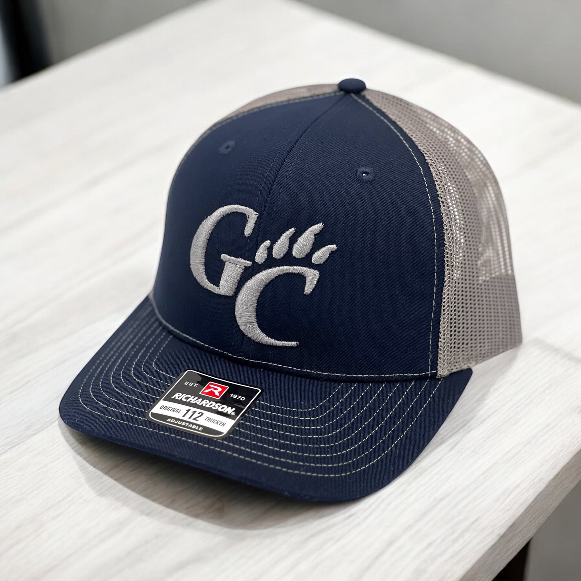 Blue hat with a logo embroidered on it