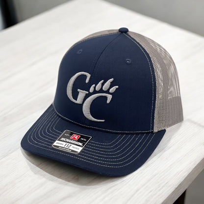 Blue hat with a logo embroidered on it
