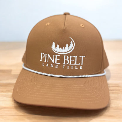 Brown hat with a logo embroidered on it