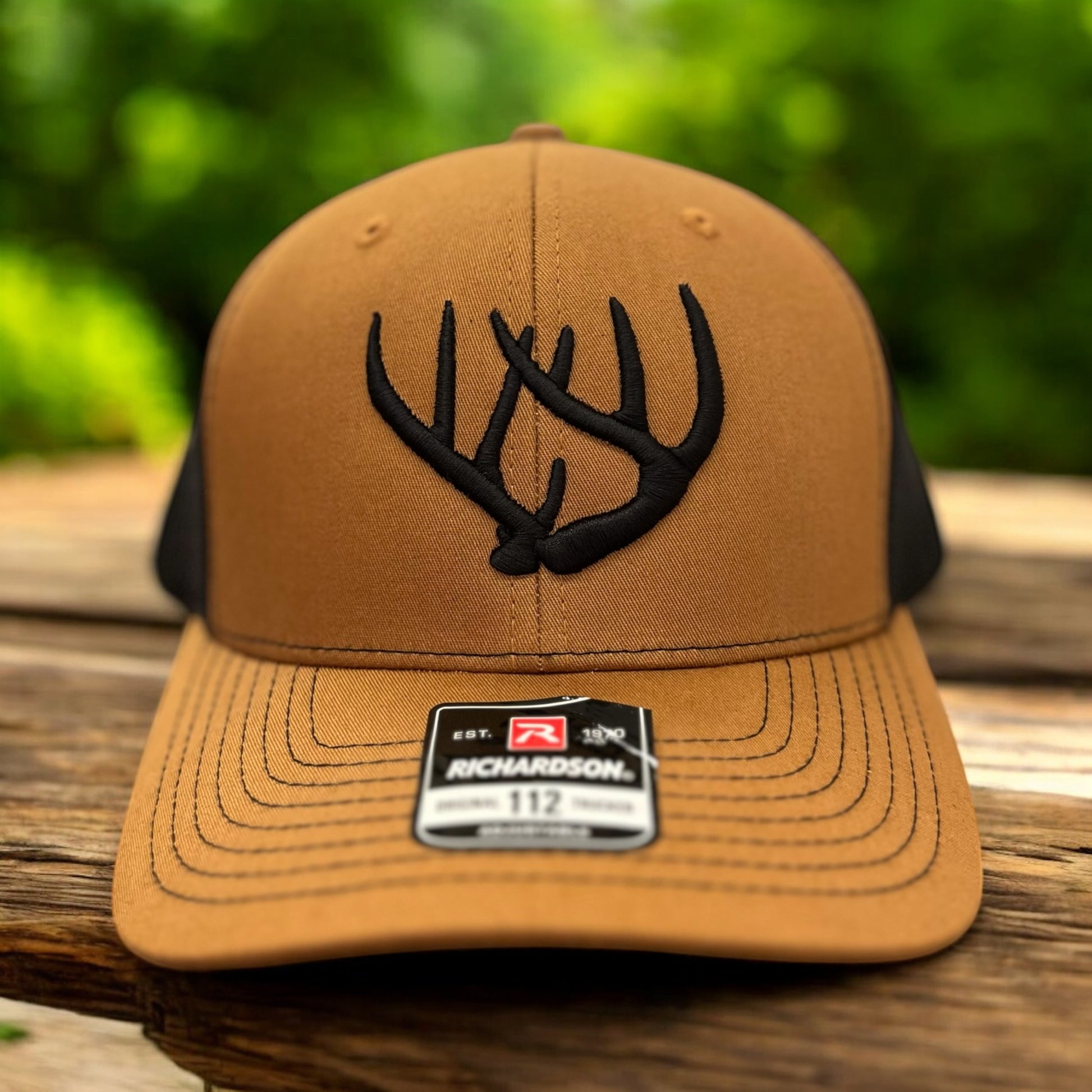 tan hat with deer horns embroidered