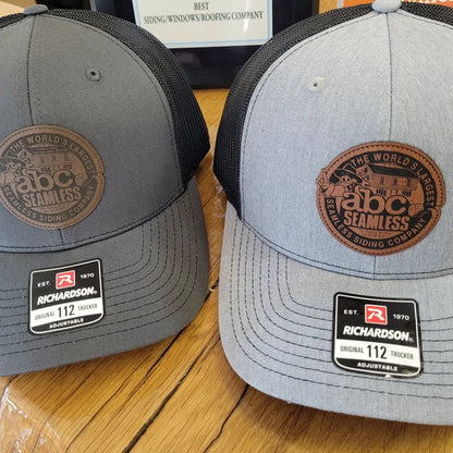 two hats with custom patches