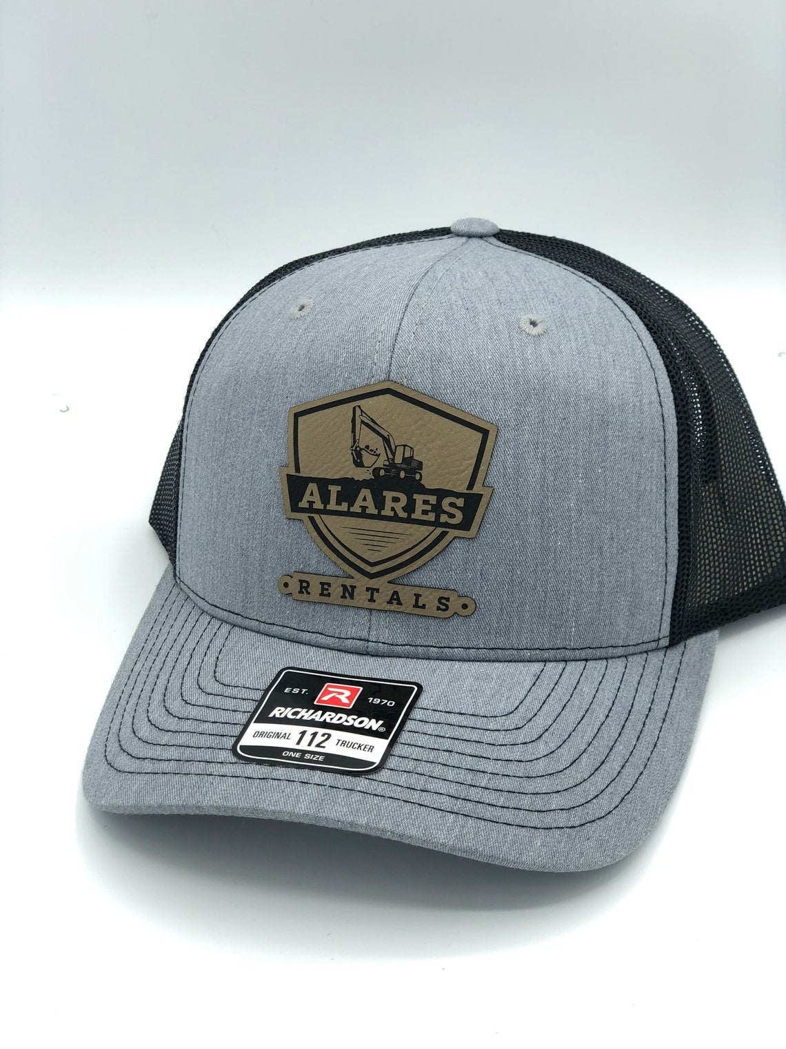 grey hat with a logo on patch