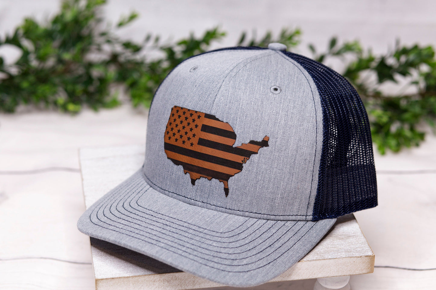 grey hat with an American Flag patch 