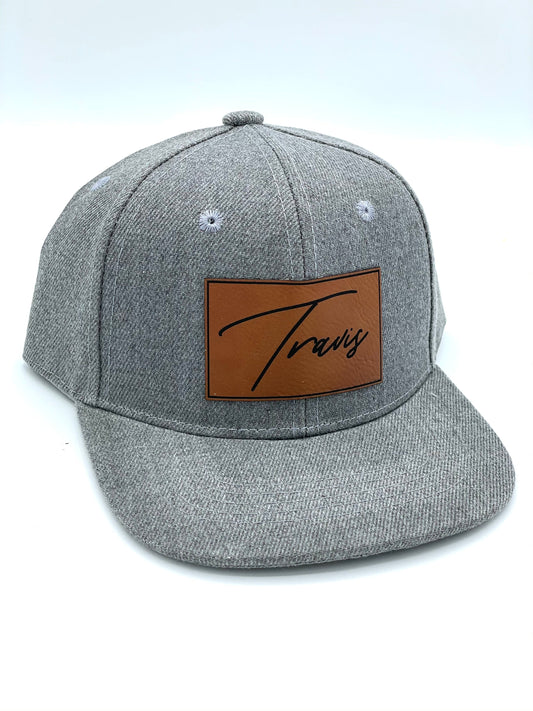 grey hat with a custom name patch