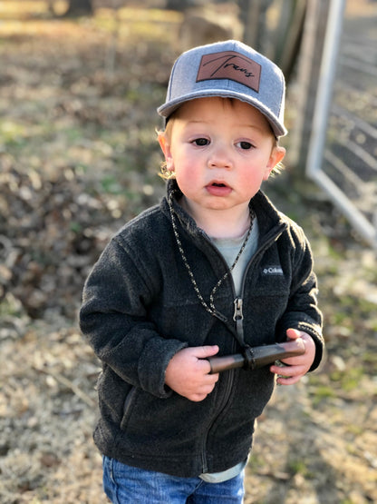 kid wearing a custom name patch hat
